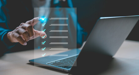 Businessman using laptop doing online checklist survey, Business performance checklist, filling out digital form checklist, take an assessment, questionnaire, evaluation, online survey.	