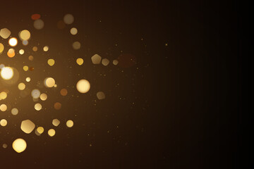 Golden glitter bokeh on black background. Holiday and celebration concept.