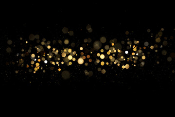 Golden glitter bokeh on black background. Holiday and celebration concept.