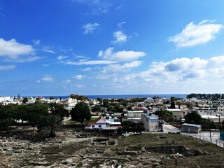 A Mediterranean coastal landscape featuring traditional architecture.
