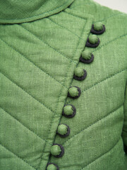 Historical fashion. Medieval knight cloth. Padded jacket gambeson.