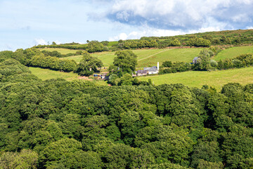 The tiny, remote farm & church at Stoke Pero (the highest church on Exmoor), Somerset UK - viewed across the wooded valley from Wilmersham