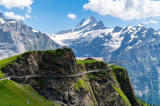 Grindelwald, Switzerland - View of Grindelwald First Cliff Walk, with many tourists walking the observation platform