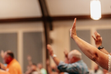 Woman in church worshiping, praise, Sunday morning	