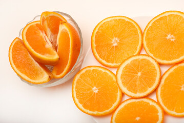 Sliced oranges on a white background. Chopped fruits.