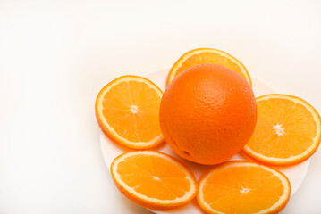 Sliced oranges on a white background. Chopped fruits.