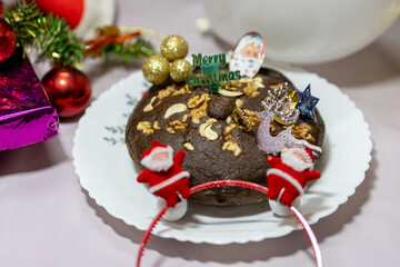 Christmas eve celebration with cake and decorative items at home at night from different angle