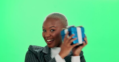 Happy, face and black woman with gift box on green screen for package, giveaway or surprise present on birthday. Prize, ribbon and excited person with parcel for celebration, retail sale or event