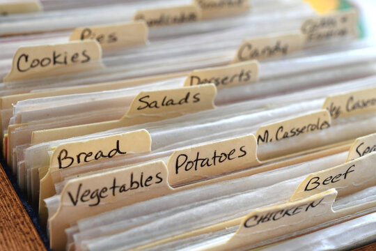 Handwritten recipe divider categories on cards filed in a recipebox box