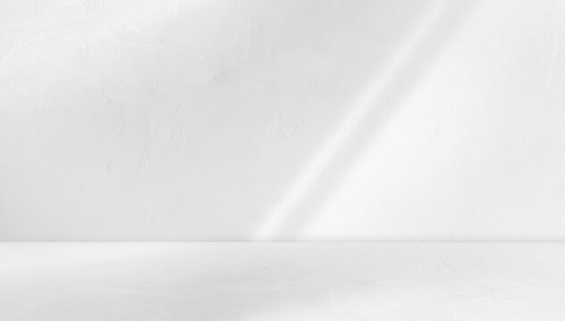white background studio room with light beam from above for product display especially cosmetic or beauty products. floor and wall backdrop muslin design backdrop. stone surface texture podium.