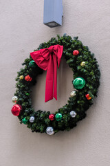 Christmas wreath with decorations on the wall