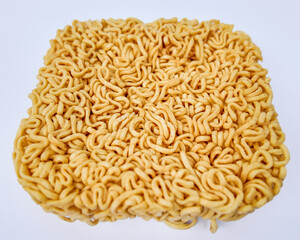 A close-up of uncooked instant ramen noodles, symbolizing budget-friendly meals and quick fixes for hunger solutions