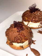 Homemade pastries choux pastries, French pastries in your own kitchen, choux with craquilene, choux with custard on the plate,Choux pastry with custard
Chou pastry recipe
How to make choux pastry
Chou