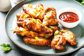 Chicken wings in bbq sauce grilled . Restaurant dish, meat griill.