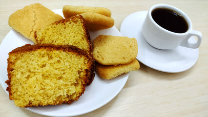 Typical brazilian breakfast containing cornmeal cake homemade cookies and coffee. Food from Minas Gerais state and from brazil.	
