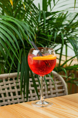Refreshing aperitif cocktail in a wine glass