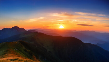 Fototapeta premium Colorful sunset in the mountains. View from the top of the mountain.