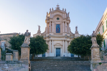 Obraz premium Facade of the beautiful sicilian baroque church Chiesa di San Giovanni Evangelista on a sunny day, Modica, Sicily, Italy