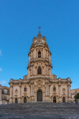 Facade of the beautiful sicilian baroque church Duomo of San Giorgio on a sunny day, Modica, Sicily, Italy