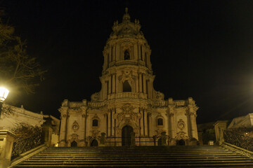 Illuminated facade of the beautiful sicilian baroque church Duomo of San Giorgio during night time, Modica, Sicily, Italy
