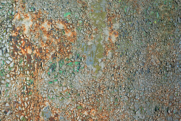 Close-up of old rusty iron sheet with cracked and destroyed paint of blue and green colors. Background. Texture