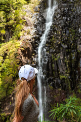 Woman in a forest near waterfall