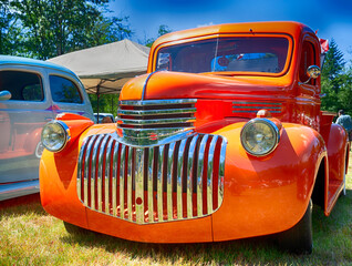 Vintage American customized truck on display at auto show.