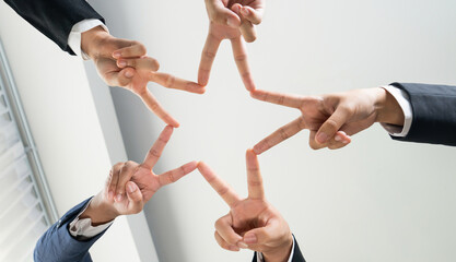 Business people collaborate business synergy and cooperation, join hand as star frame around empty...