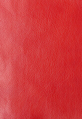 Texture of genuine leather, artificial leatherette red background