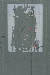 torn wheatpaste poster frayed paper frame on concrete wall background