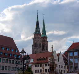Street lights against the backdrop of St. Lorenz Cathedral and Schoener Brunnen in Nuremberg, Bavaria
