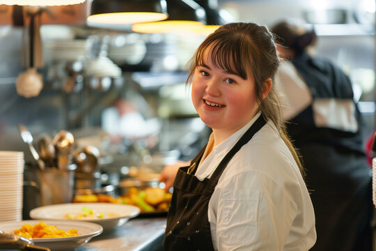 Portrait of a Girl with Down Syndrome working in the Restaurant Kitchen, Close up Young Disabled Girl with Freckles, Fringe, Happy with Disability