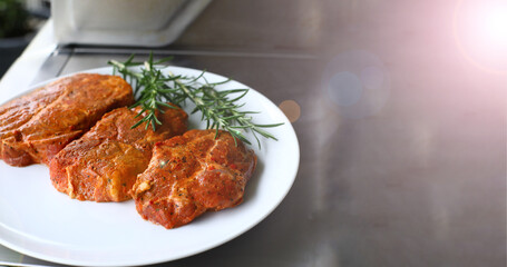 Meat with aromatic spices, home grill. Raw meat for grilling.