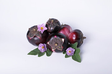 Fresh ripe purple eggplants, eggplant vegetables on a light background, space for text