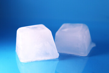 square ice cubes on a blue background