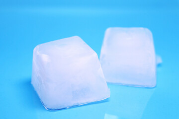 square ice cubes on a blue background