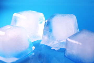 square ice cubes on a blue background