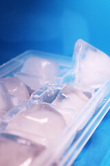 square ice cubes on a blue background