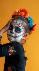 Young girl with Day of the Dead face paint and colorful flowers