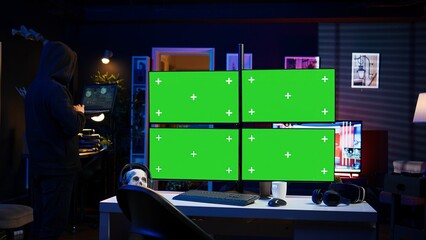 Hacker using isolated screen multi monitor PC setup, doing computer sabotage using ransomware....