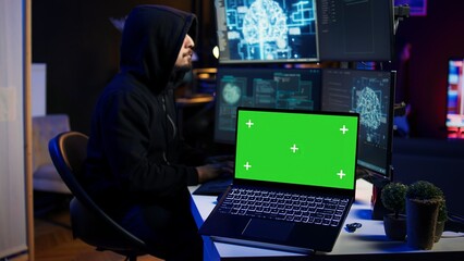 Isolated screen laptop used by cybercriminal in underground hideout to write lines of code and malware scripts. Mockup notebook used by evil programmer in hidden bunker, close up shot, camera B