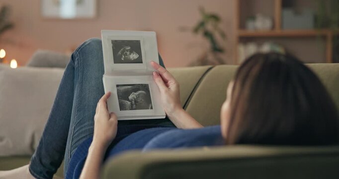 Pregnant, relax and ultrasound with woman on sofa in living room of home for prenatal wellness. Picture, pregnancy and sonogram with mother looking at baby scan in apartment for maternal love