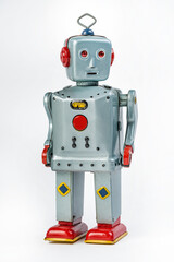 A very antique tin robot toy airplane isolated in white with clipping path.
Retro gray and red...