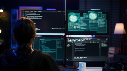 Dangerous hacker writing lines of code on PC from secret apartment, trying to get past security...