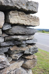 Gray stone blocks with soil and plants.

