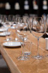 many clean wineglasses in bar, professional equipment , relax time, shiny wineglasses for catering food, kitchenware supply shop products	