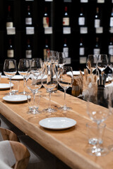 many clean wineglasses in bar, professional equipment , relax time, shiny wineglasses for catering food, kitchenware supply shop products	