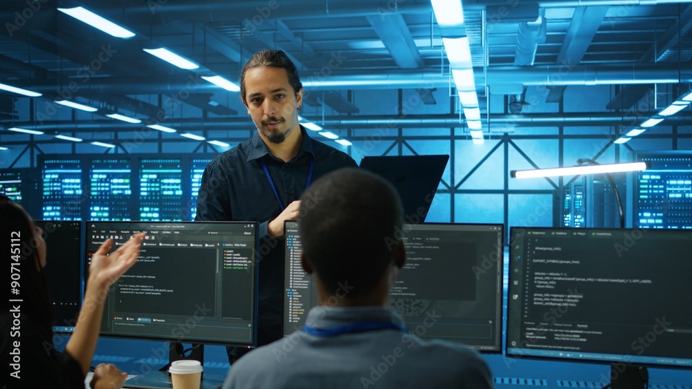 Poster manager supervising multiethnic team working in data center ensuring optimal performance. supervisor