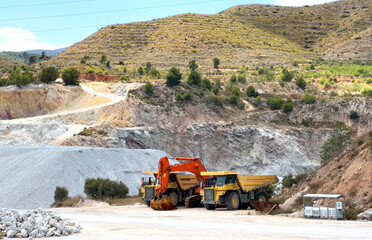 Mining truck in open-pit mining. Excavator and Haul truck on lithium miningcivil works and...