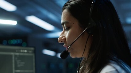 IT expert in data center provides technical support to customers, troubleshooting issues, close up. Server room employee carrying out operational technical interventions requested by clients, camera A - Powered by Adobe